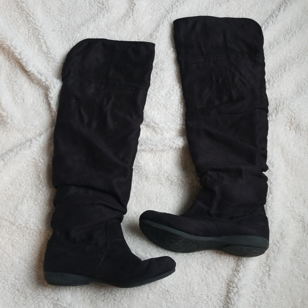 Black knee high boots.